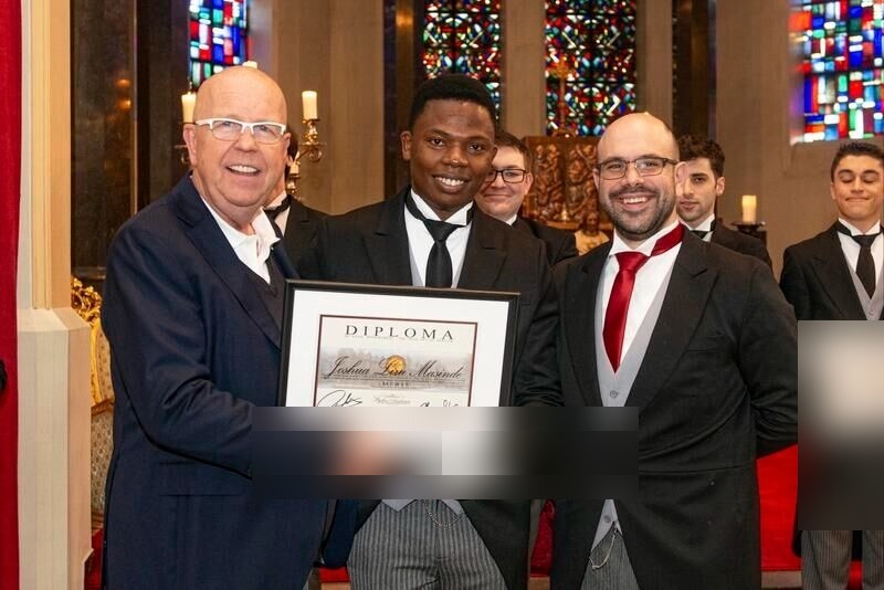MJ LIRU receiving his diploma certificate at The International Butler Academy